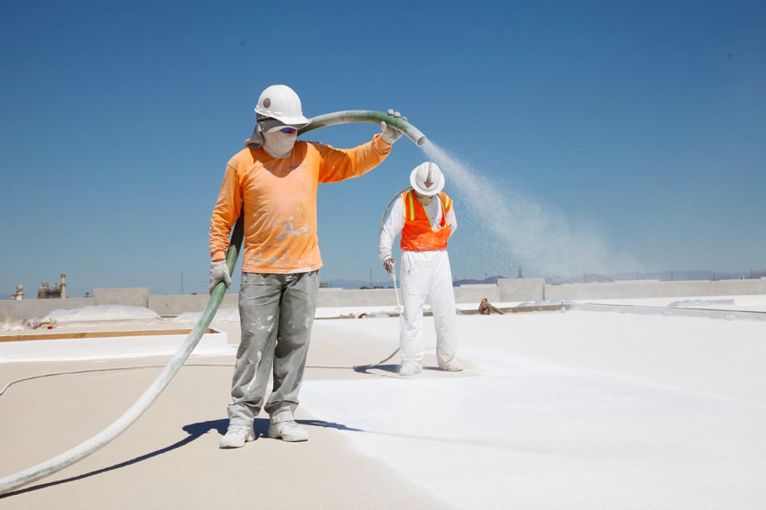 SWD Insulation technicians insulating flat roof.