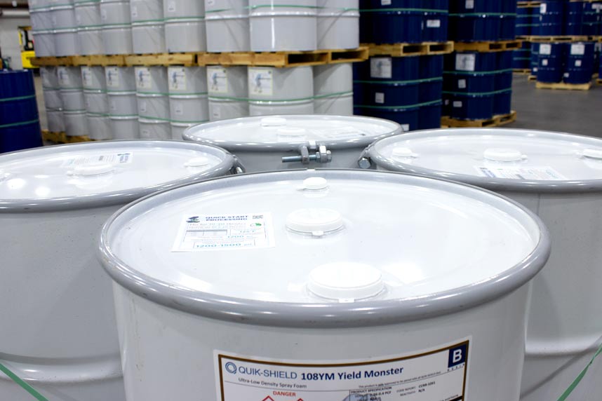 Quik-Shield® 108YM up close of product container, and background of warehouse filled with product containers.