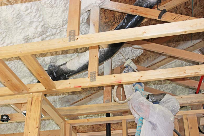 Home’s wall structure insulated with Quik-Shield® DRAGON Open-Cell Spray Foam.