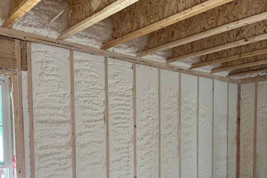 Home’s wall structure insulated with Quik-Shield® DRAGON Open-Cell Spray Foam.