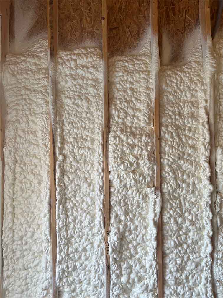 Close-up detail of Quik-Shield Dragon XL spray foam insulation showing smooth, dense closed-cell structure for optimized thermal performance.